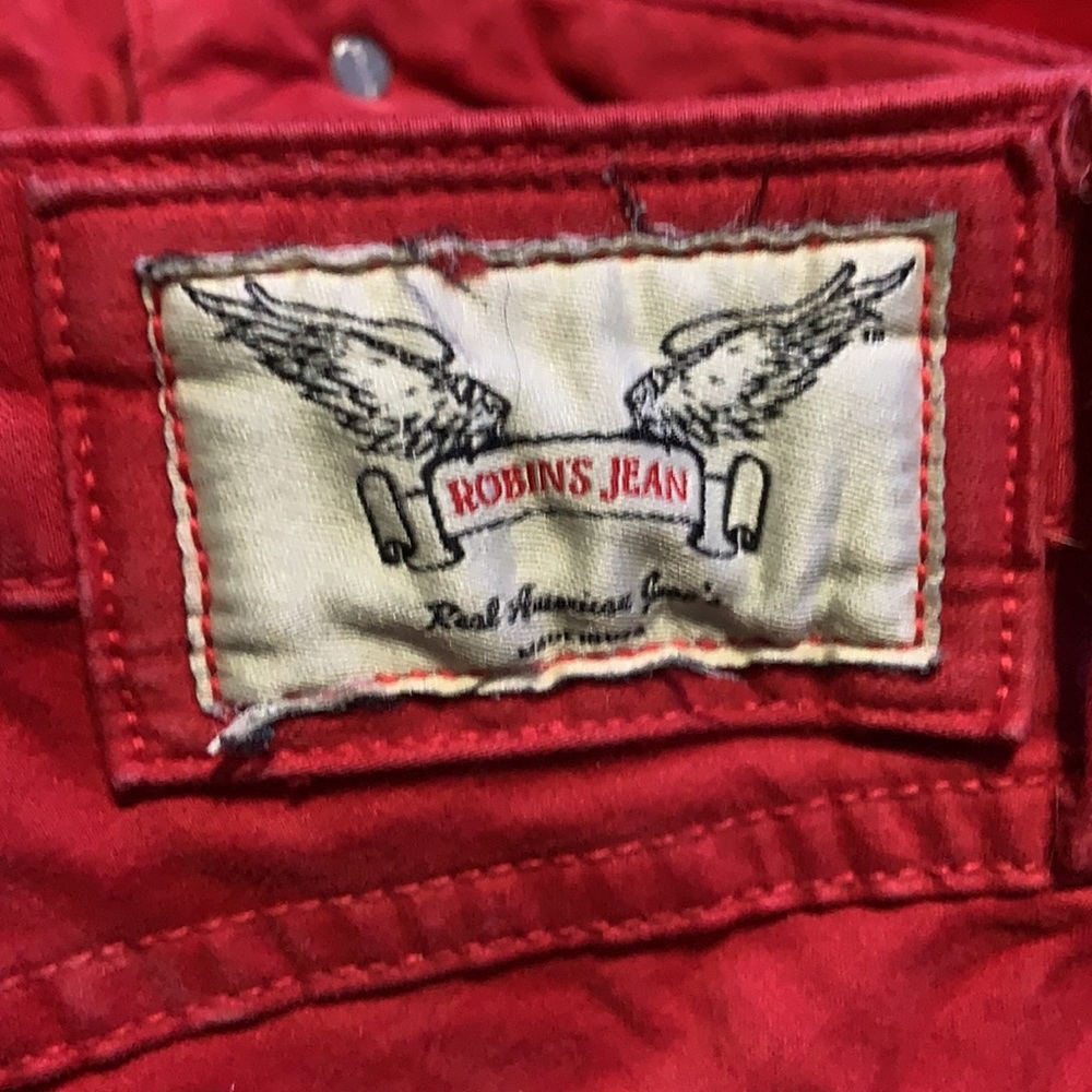 Used red Robin’s Jeans with crystals. Size 26